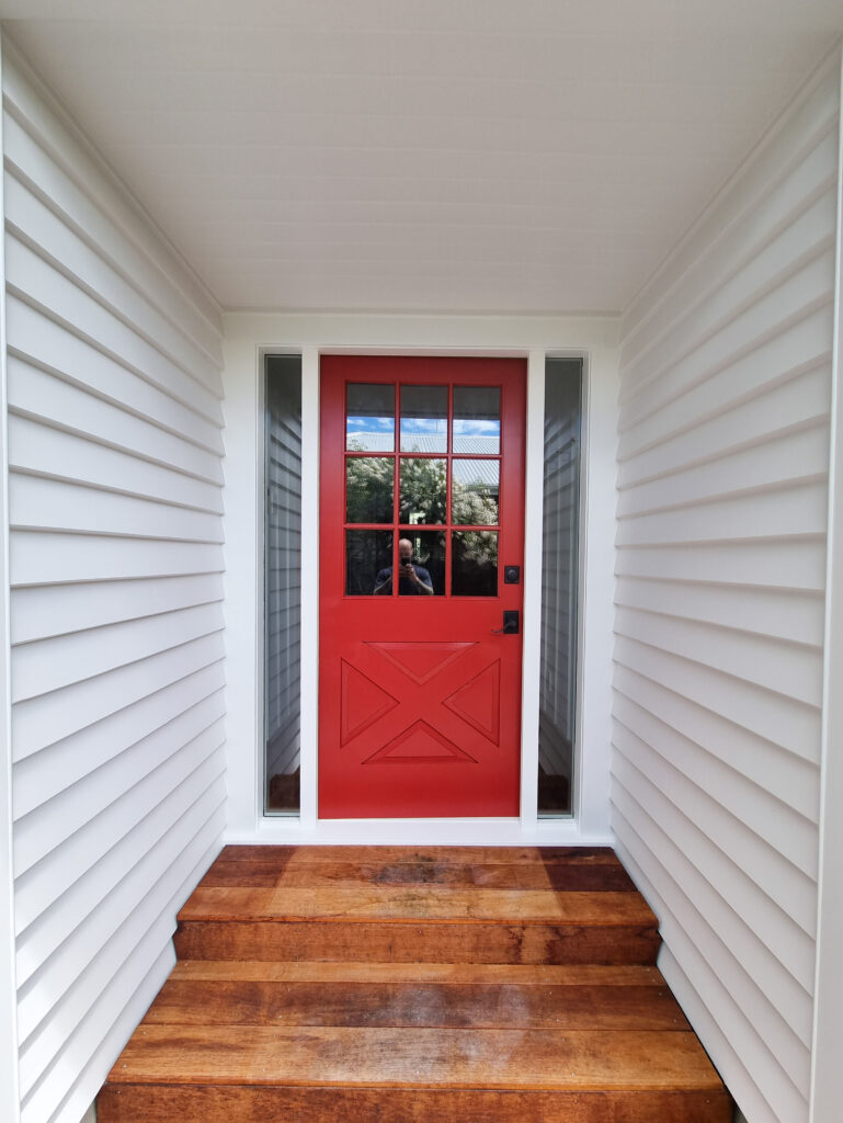 Residential painting front door red with white exterior painting Christchurch